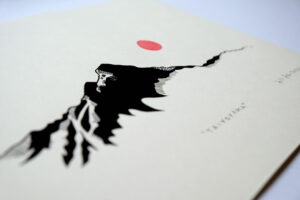 Detail of minimalist art print by artist Till Steinberger showing stylized mountain with red sun